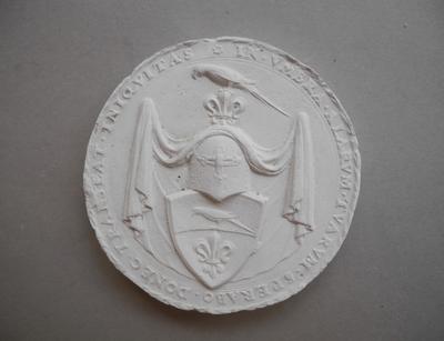 Tirage d'une médaille : écu fleurdelisé orné d'un oiseau de proie