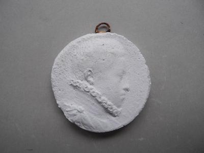 Tirage d'une médaille : buste d'homme de profil