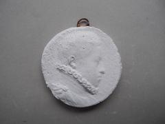 Tirage d'une médaille : buste d'homme de profil
