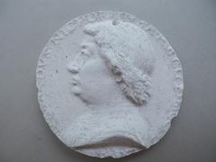 Tirage d'une médaille : buste d'homme de profil gauche