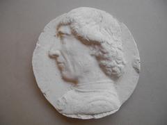 Tirage d'une médaille : buste d'homme de profil gauche
