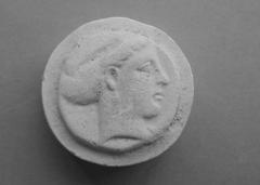 Tirage d'une monnaie : tête féminine, de profil droit.