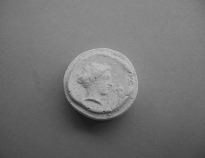 Tirage d'une monnaie : tête de profil droit
