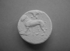 Tirage d'une monnaie : figure zoomorphe et palmier