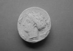 Tirage d'une monnaie : tête de profil gauche