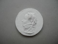 Tirage d'une médaille : buste féminin de profil